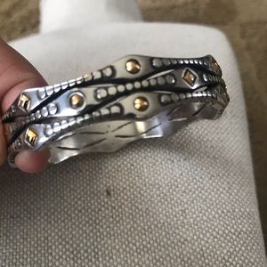 Brighton silver bangle bracelet with scalloped edges and gold accents.